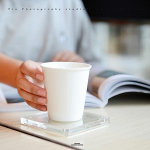 Transparent Product Amazon Product Photography china The woman is reading a book with a cup.