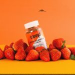 Chinese product photography vitamin bear lifestyle letter paper strawberry orange background